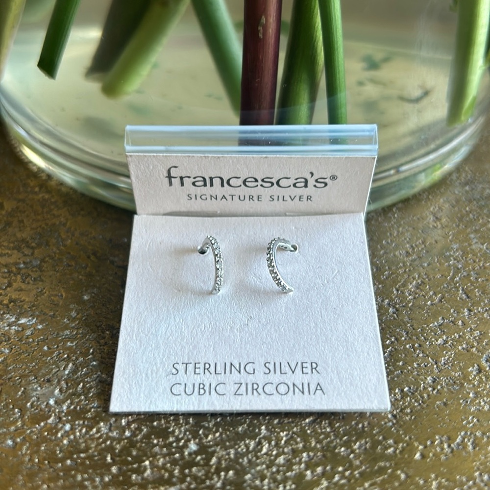 Francesca’s signature silver earrings
